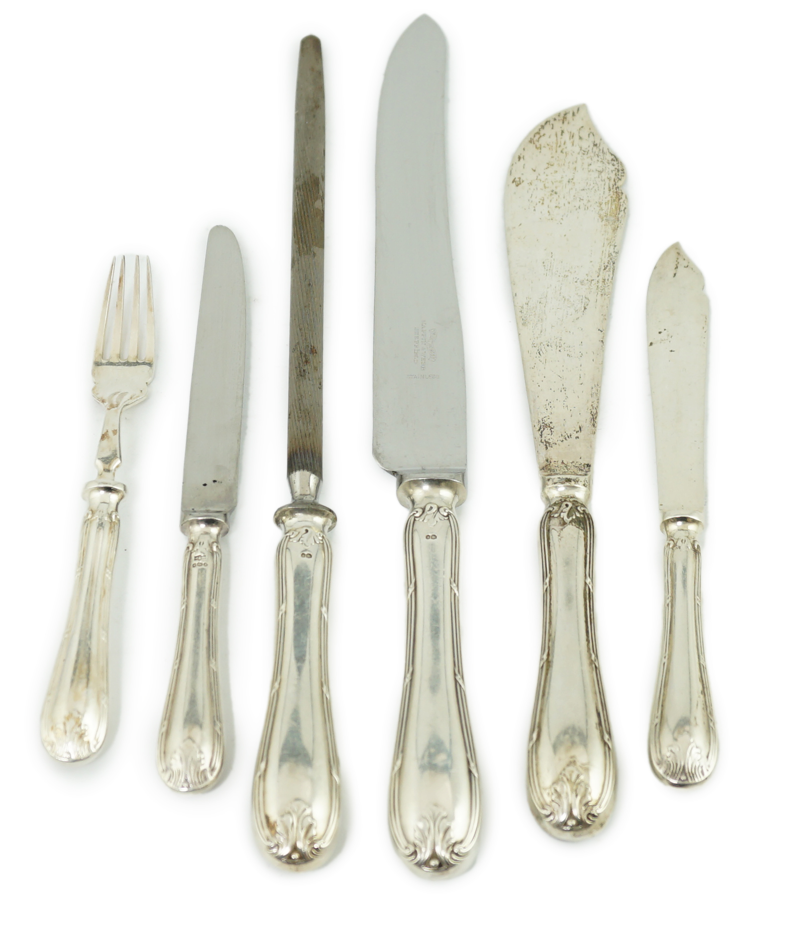 A modern part canteen of silver cutlery, comprising eight pairs of silver fish eaters, pair of fish servers, eight silver handled steel table knives and eight dessert knives and a three piece carving set